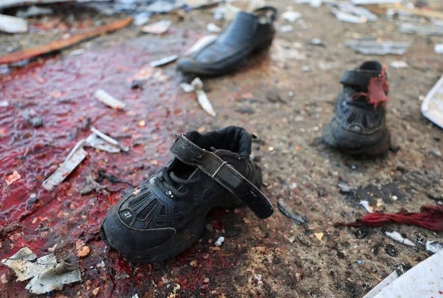 Thumbnail preview image for the video titled: Blood-splattered child's shoes at scene of Israel's massacre of Palestinians at Gaza Port
