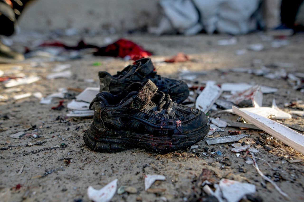Thumbnail preview image for the video titled: Blood-splattered child's shoes at scene of Israel's massacre of Palestinians at Gaza Port