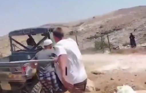 Thumbnail preview image for the video titled: A settler teenager attacks the disabled Palestinian Sheikh Saeed Al Amour in the village of Al Rakeez