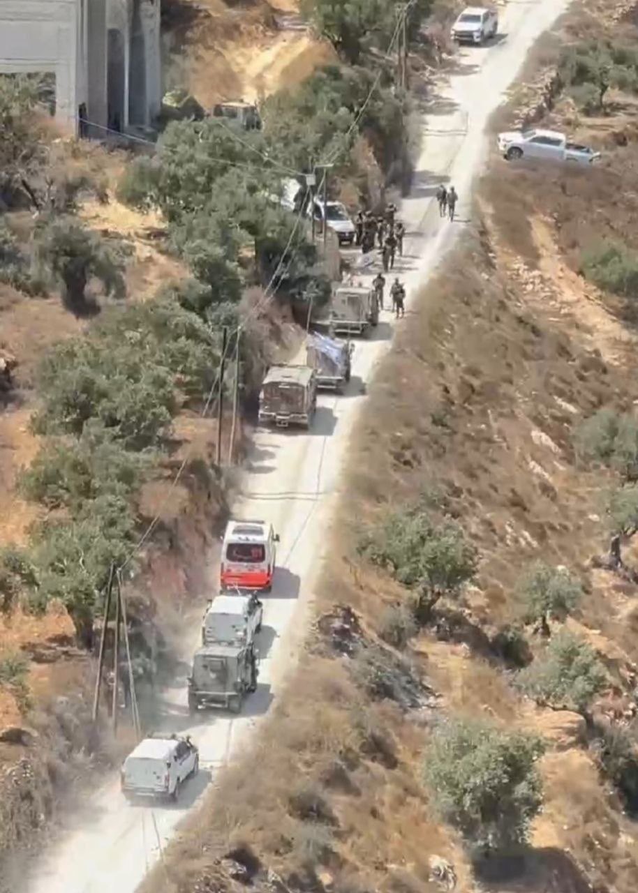 Thumbnail preview image for the video titled: Israeli military vehicles blocking a Palestinian ambulance from evacuating Palestinian stoned by settlers