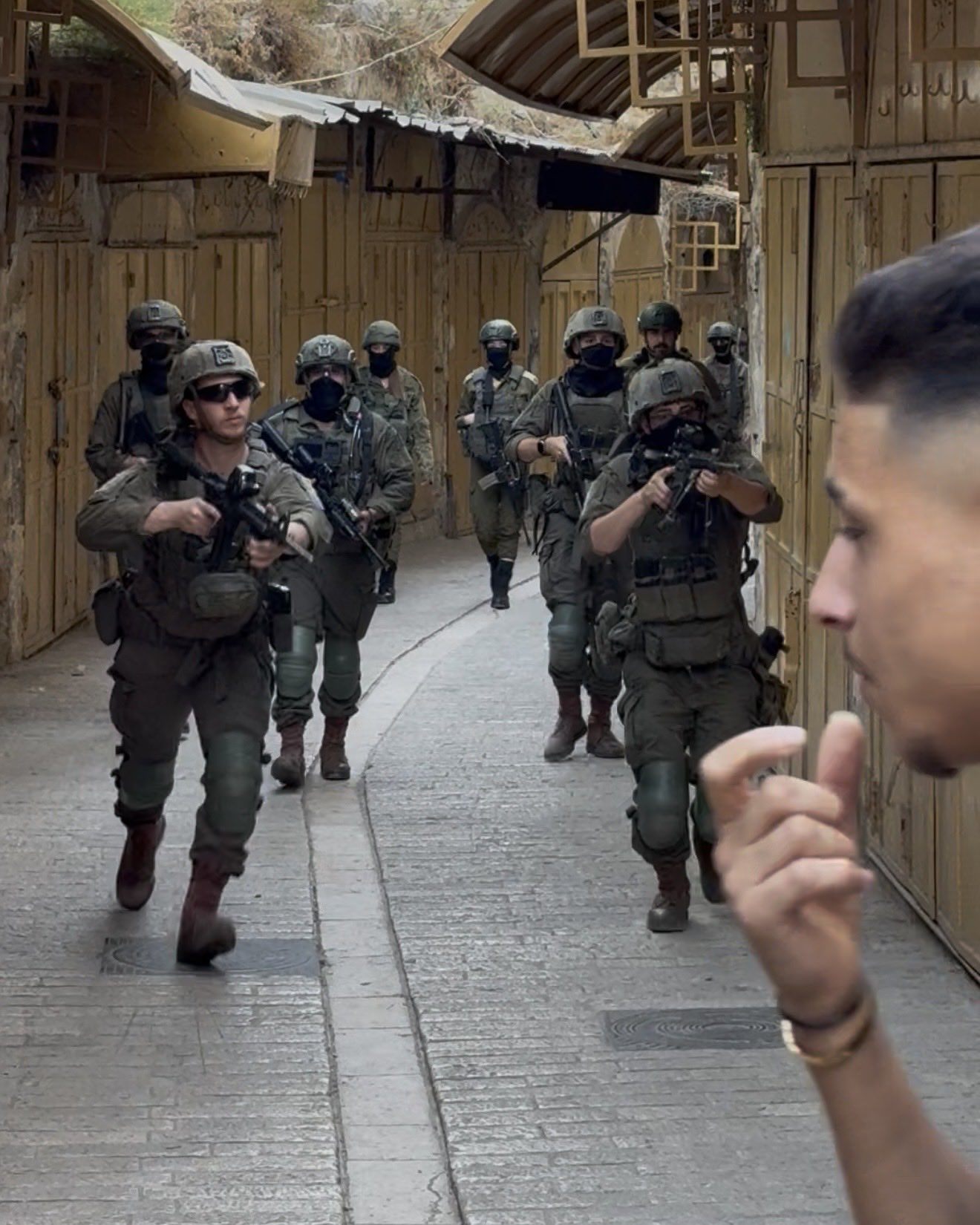 Thumbnail preview image for the video titled: What Palestinians in Hebron’s Old City endure every Shabbat during settler marches