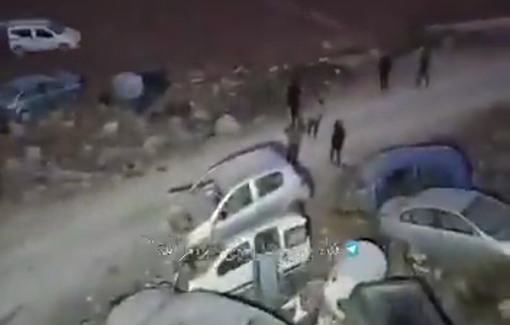 Thumbnail preview image for the video titled: Israeli settlers, backed by soldiers, storm the village of Al-Mughayyir overnight
