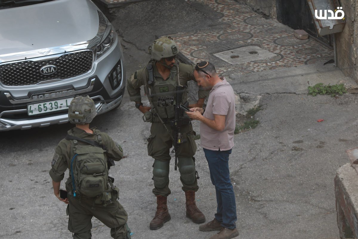 Thumbnail preview image for the video titled: Israeli settlers, backed by Israeli forces, bulldozed Palestinian land on Shuhada Street in the Old City of Hebron