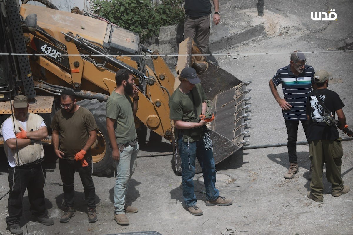 Thumbnail preview image for the video titled: Israeli settlers, backed by Israeli forces, bulldozed Palestinian land on Shuhada Street in the Old City of Hebron
