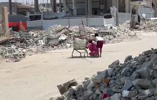 Thumbnail preview image for the video titled: Children take cover from Israeli gunfire while transporting water