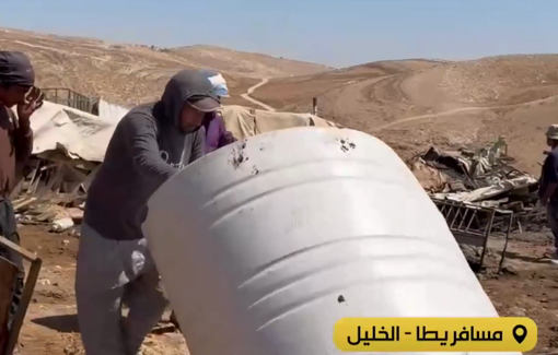 Thumbnail preview image for the video titled: Palestinian residents of Khirbet al-Fakheit start to rebuild their homes and facilities that the Israelis have just destroyed