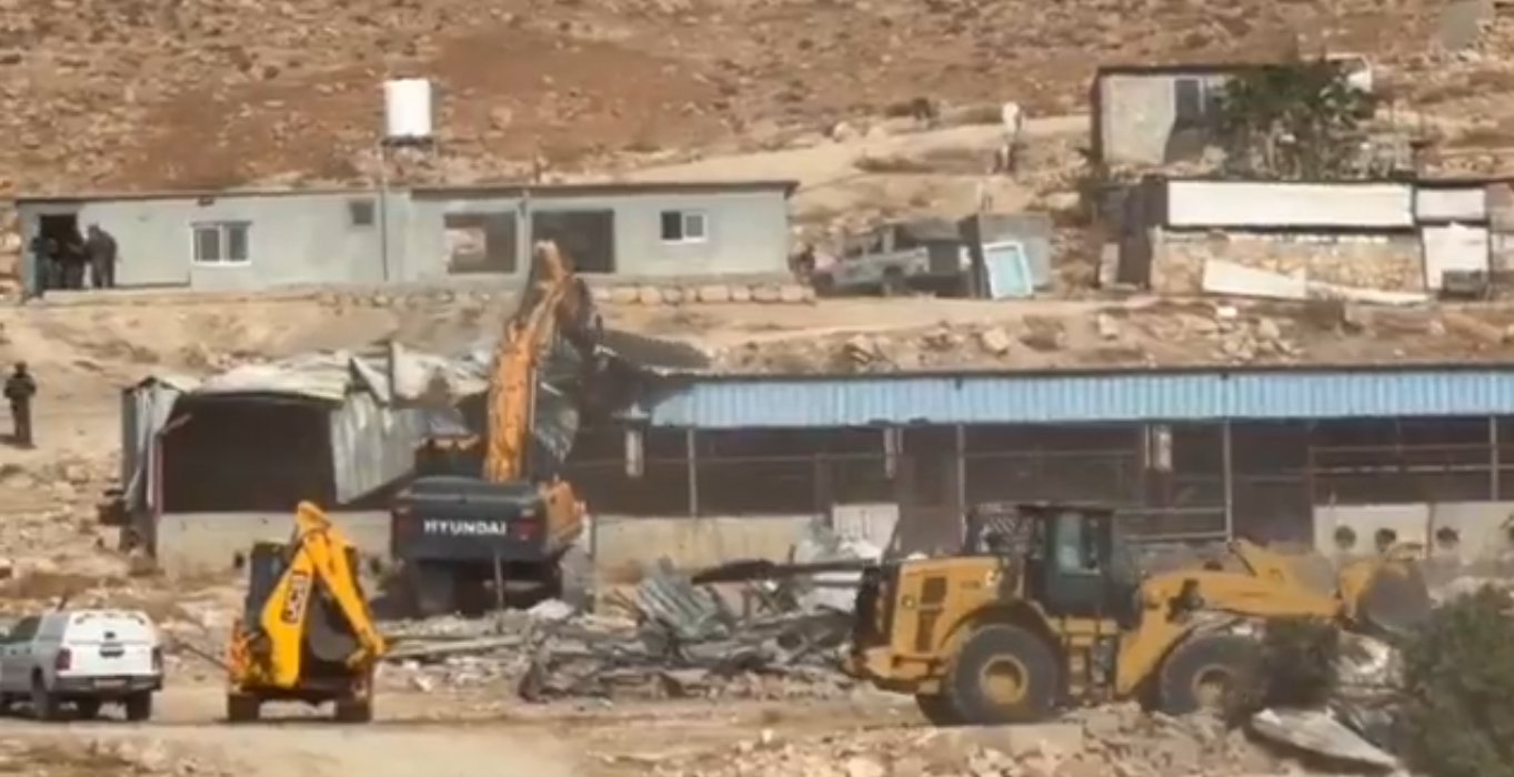 Thumbnail preview image for the video titled: Israeli forces demolishing Jinba structures using Caterpillar, Hyundai and JCB machinery in Jinba, Masafer Yatta, September 23 2026