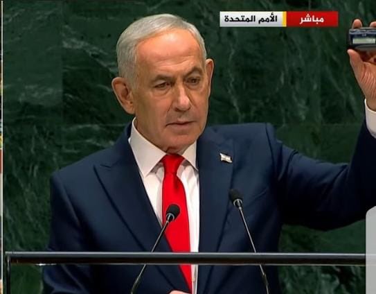 Thumbnail preview image for the video titled: Benjamin Netanyahu holds up a pager during his UNGA speech, highlighting one of the most sinister terrorist attacks in modern history
