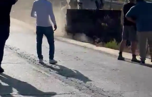 Thumbnail preview image for the video titled: In Beit 'Ur, a settler threats the owner of a Palestinian land with his bulldozer