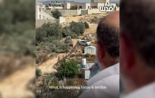 Thumbnail preview image for the video titled: A devastated Palestinian man watches as the Israelis uproot his olive trees in Beit Umrin