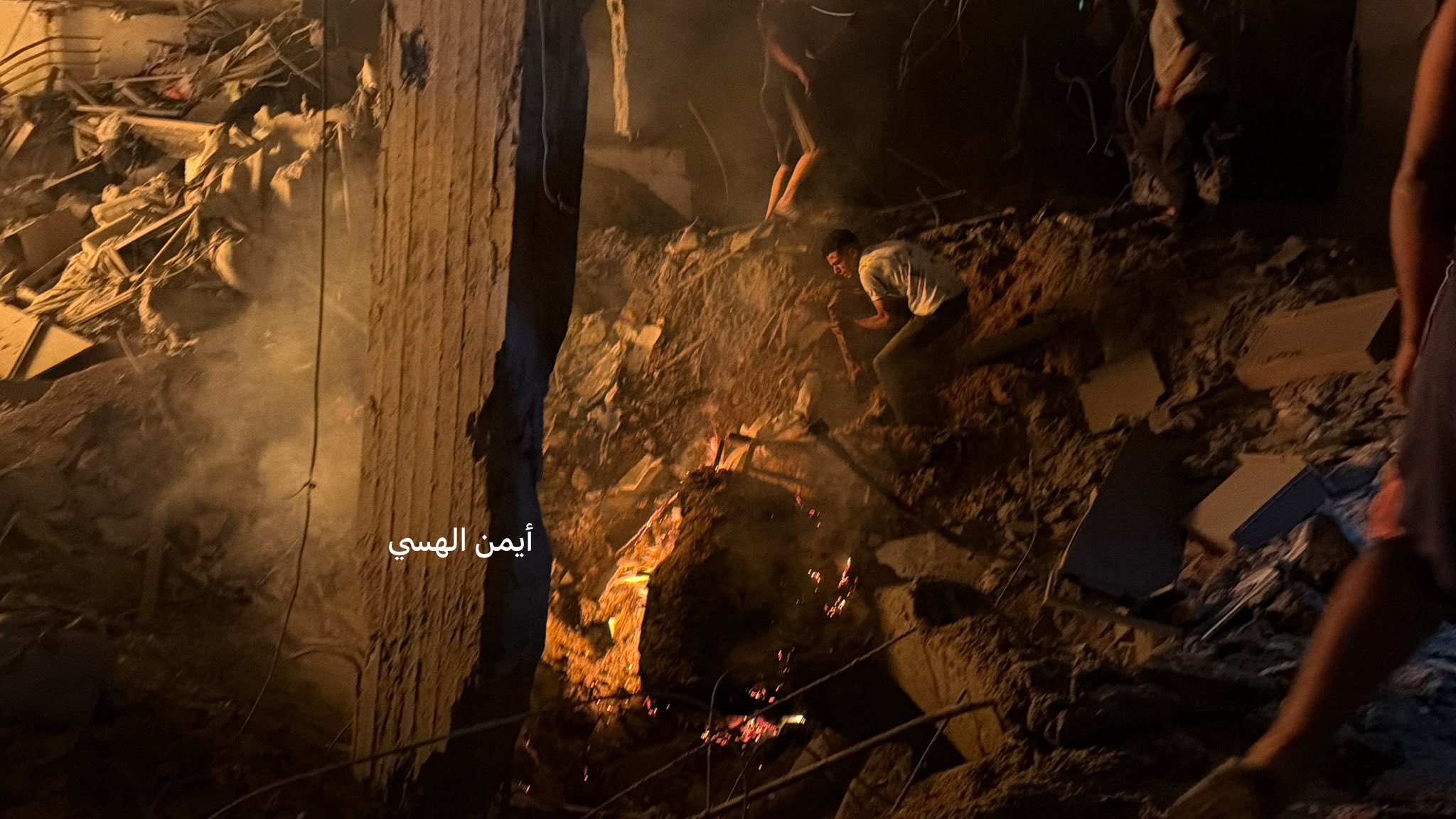 Thumbnail preview image for the video titled: Rescue teams search for victims trapped under rubble after Israel bombed apartment late at night
