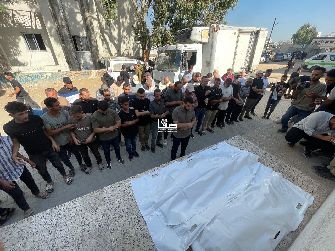 Thumbnail preview image for the video titled: Funeral prayer for Palestinians killed in their sleep by Israeli bombing of their residence