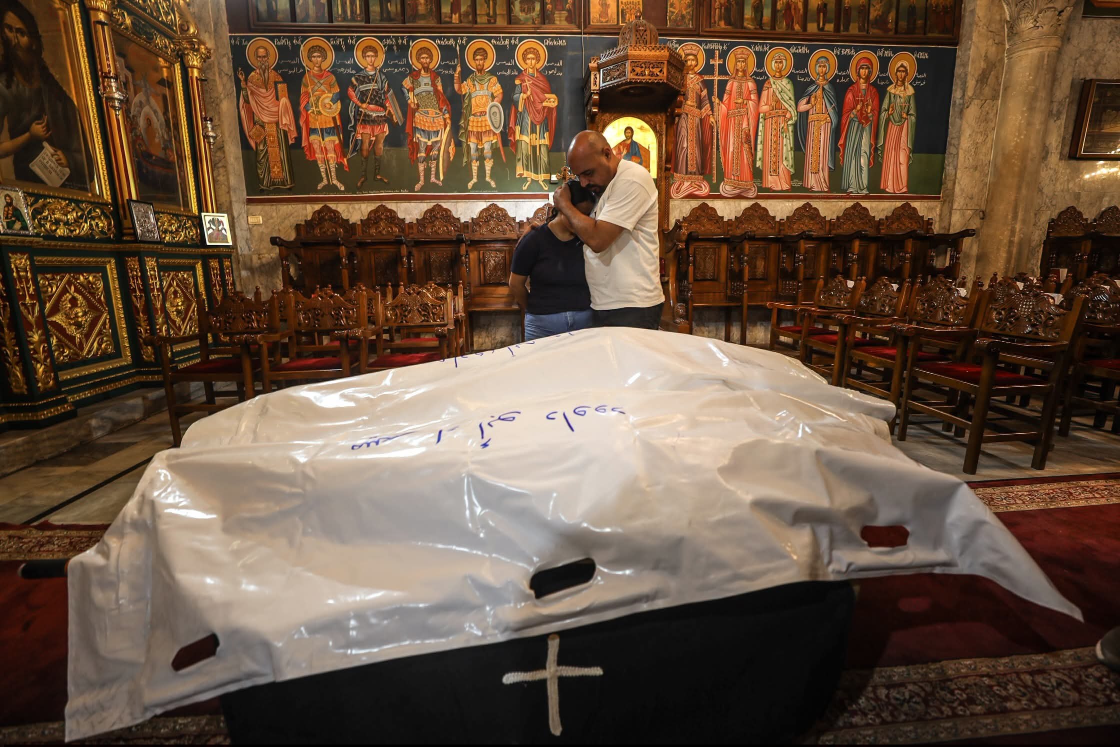 Thumbnail preview image for the video titled: Funeral of Christian mother and daughter killed by Israel's bombing of their apartment in Gaza City