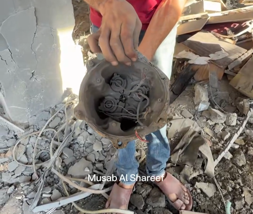 Thumbnail preview image for the video titled: Remnant of GBU-39 bomb used by Israel to massacre 5 Palestinians in their sleep in Gaza City
