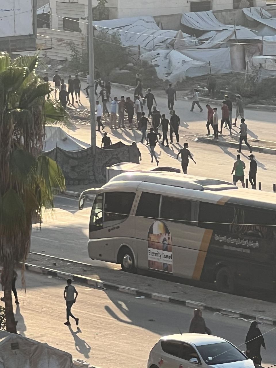 Thumbnail preview image for the video titled: Crowd gathers after Israeli drone struck a young man on a bike on Salah al-Din Street