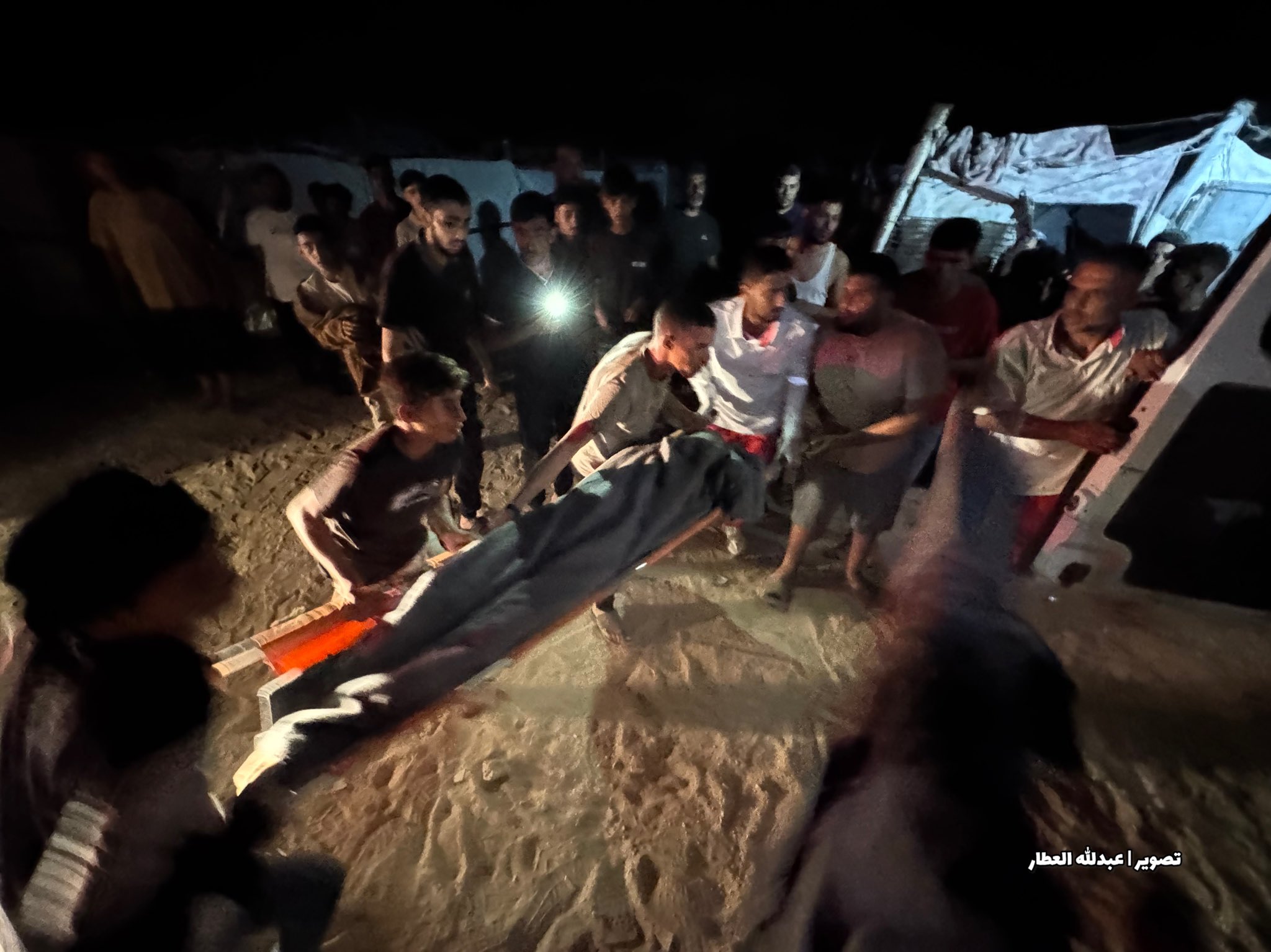 Thumbnail preview image for the video titled: Rescue crews recover the bodies of Palestinians killed by Israeli strike on tent in Khan Younis