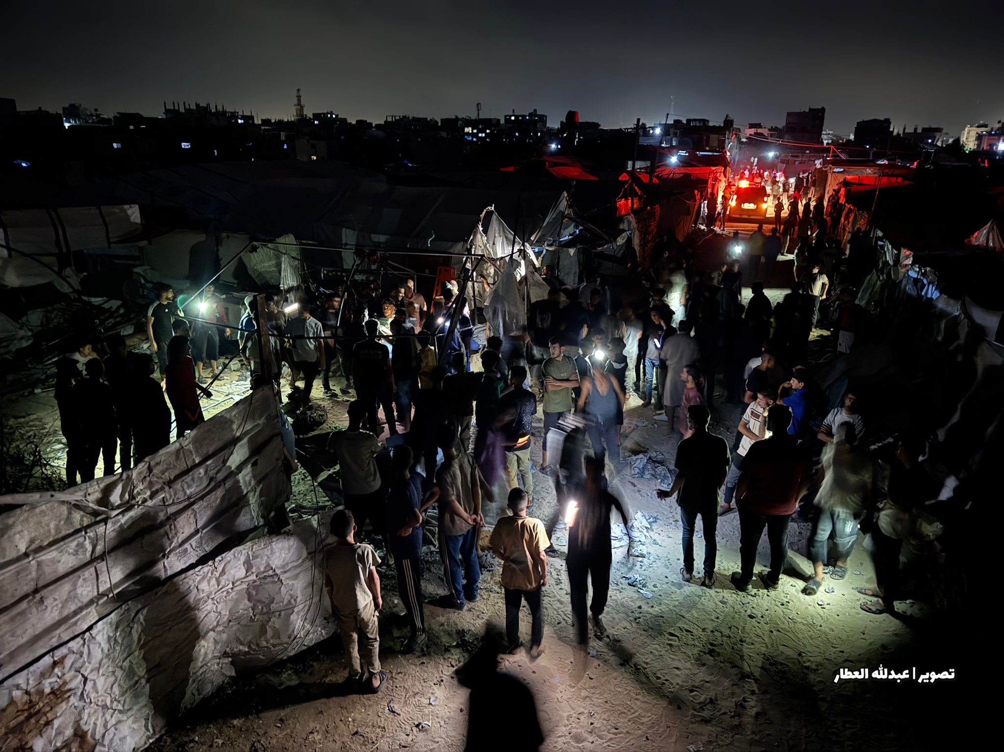 Thumbnail preview image for the video titled: Civilians gather at massacre scene to help rescue efforts