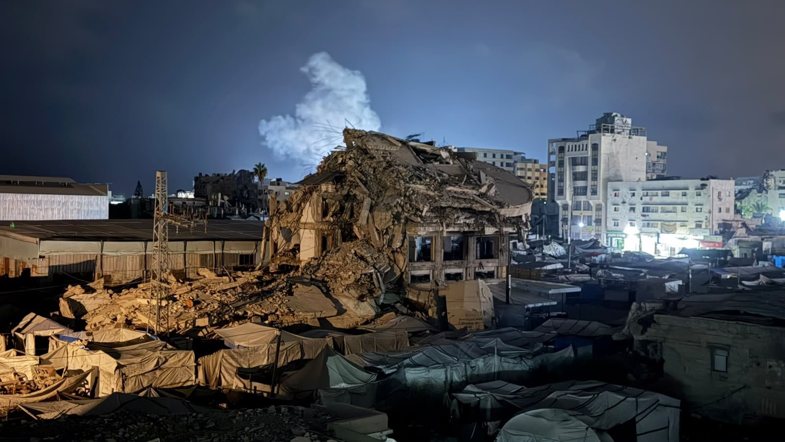 Thumbnail preview image for the video titled: Smoke rises after deadly 4am Israeli bombing of an apartment