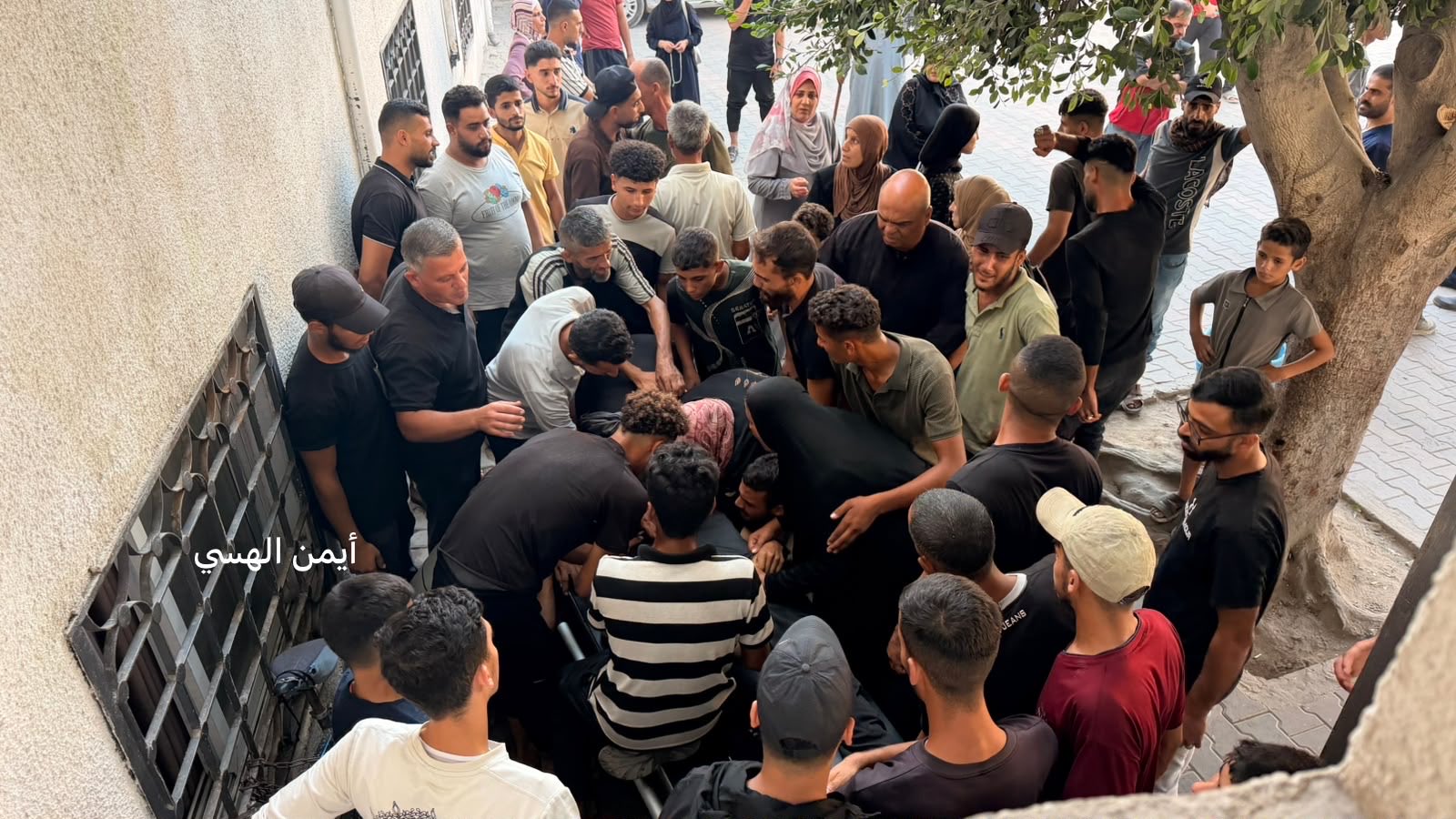 Thumbnail preview image for the video titled: Relatives throng the body of young man killed by Israeli gunfire