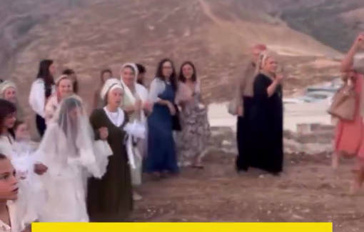 Thumbnail preview image for the video titled: Israeli settlers hold a wedding celebration on Palestinian land seized by the occupation in the Al-Khunaidiq area of Beit Anan