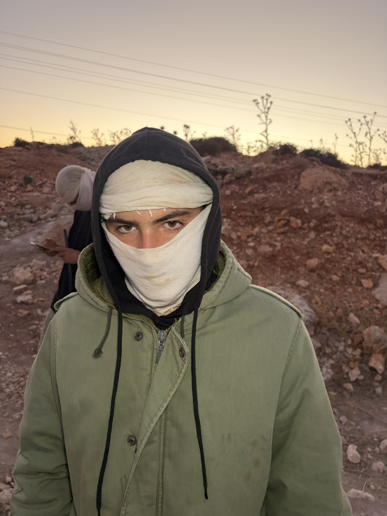 Thumbnail preview image for the video titled: In Dar Faza'a, the settlers Josef Haim and Yedidya Cohen, prevent the olive harvest and assault journalists