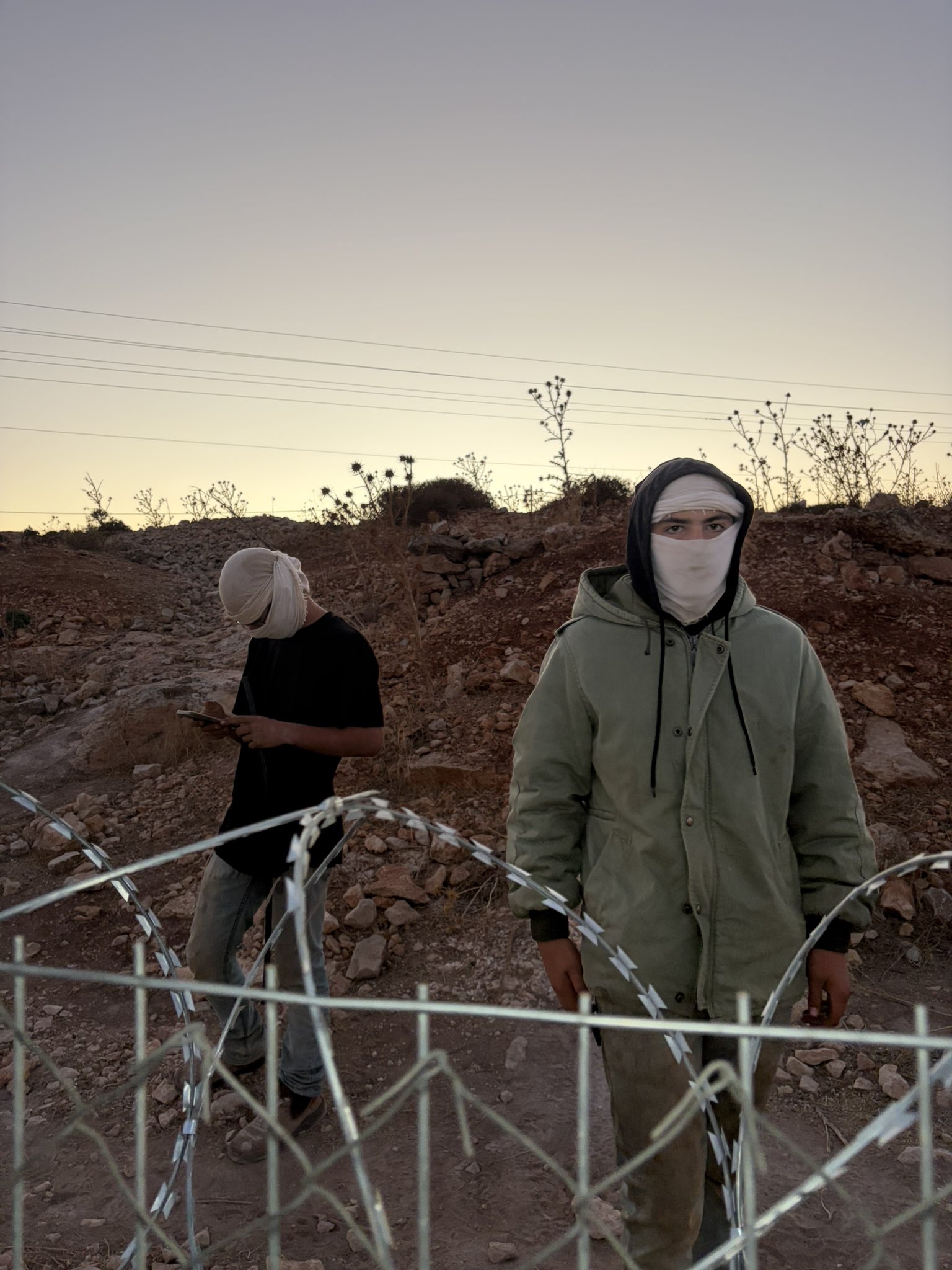 Thumbnail preview image for the video titled: In Dar Faza'a, the settlers Josef Haim and Yedidya Cohen, prevent the olive harvest and assault journalists