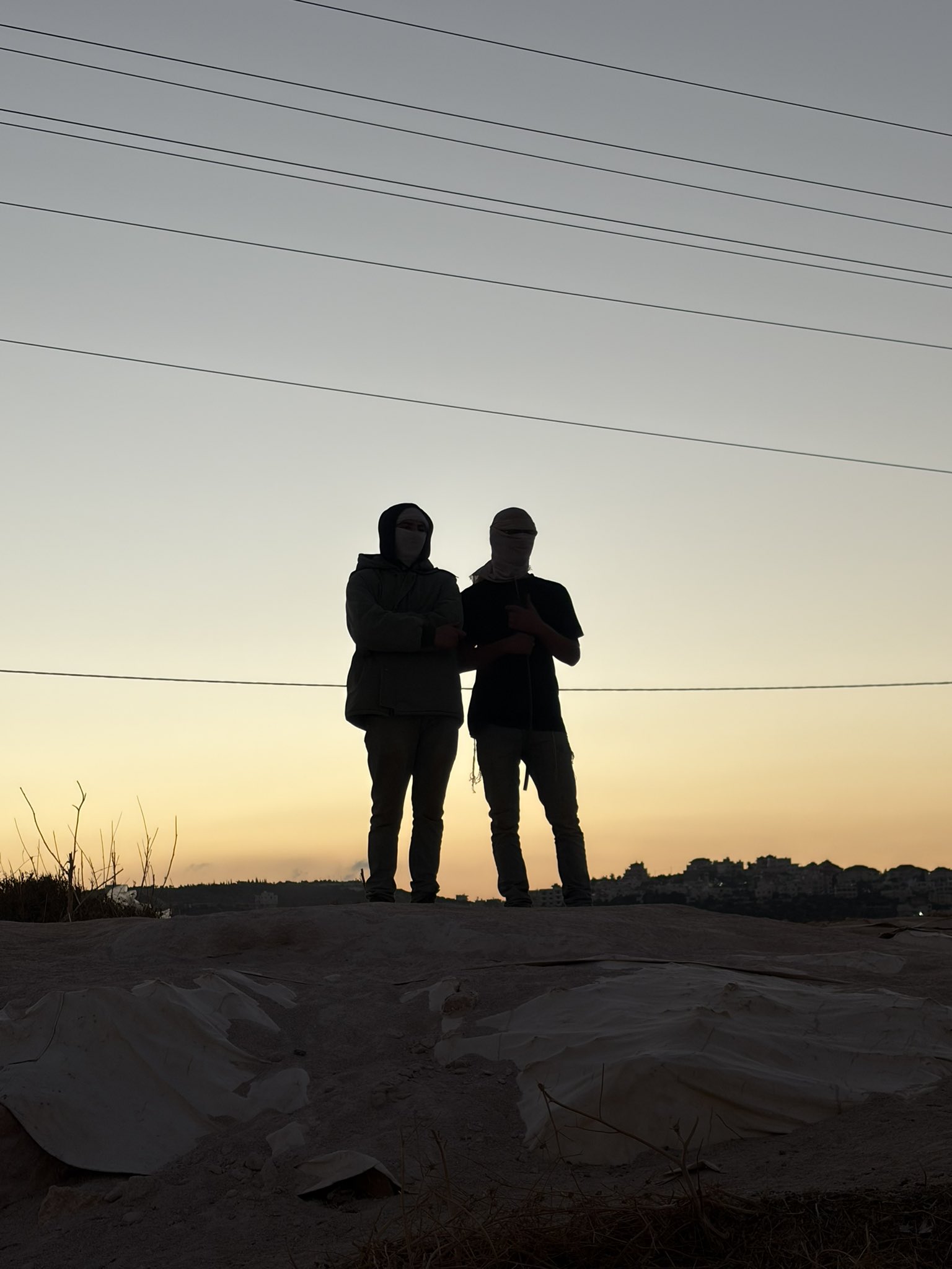 Thumbnail preview image for the video titled: In Dar Faza'a, the settlers Josef Haim and Yedidya Cohen, prevent the olive harvest and assault journalists