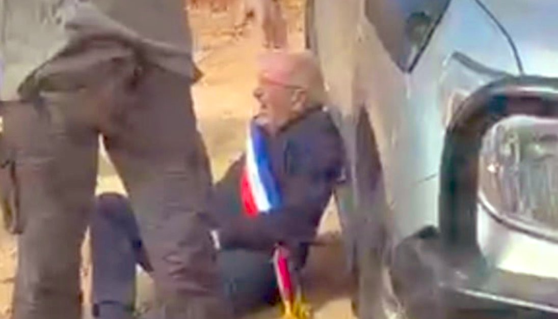 Thumbnail preview image for the video titled: Masked Israeli settlers attacked a convoy of European diplomats from France, Belgium and Poland in the Christian Palestinian village of Taybeh