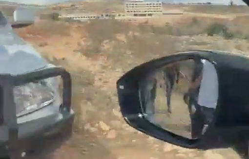 Thumbnail preview image for the video titled: Protective presence vehicle surrounded in Taybeh before being assaulted by Jewish settlers
