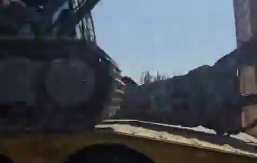 Thumbnail preview image for the video titled: Israeli Hyundai excavator en route to demolish homes in Hebron in retaliation of the shooting incident