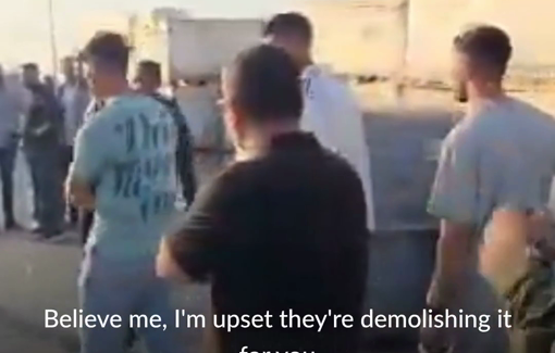 Thumbnail preview image for the video titled: An Israeli settler curses Palestinian shopkeepers rushing to evacuate as Israeli forces demolish their stores at Hebron’s entrance