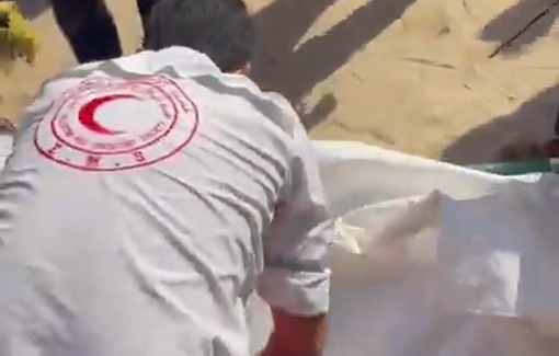 Thumbnail preview image for the video titled: Paramedics recover body of police officer killed in Israeli strike on a car