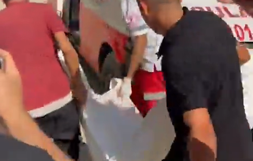 Thumbnail preview image for the video titled: Paramedics recover body of police officer killed in Israeli strike on a car