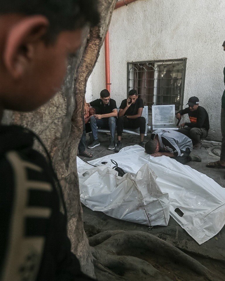 Thumbnail preview image for the video titled: Child looks on young Plaestinians mourning their relatives killed in Gaza City