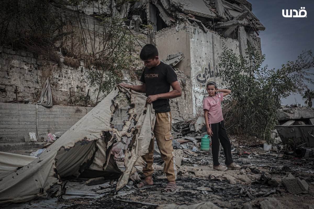 Thumbnail preview image for the video titled: Children inspect the torched remains of their tents burned down by Israeli drones